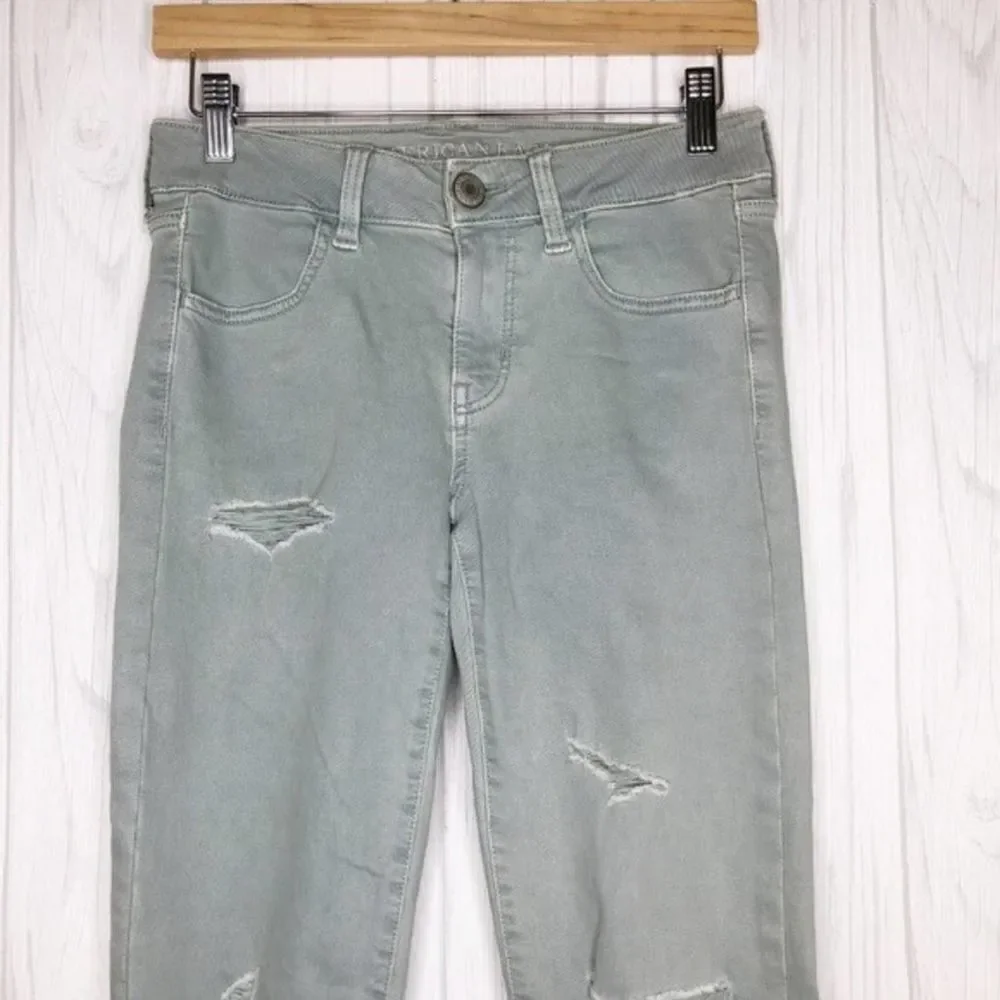AMERICAN EAGLE Seafoam Destroyed Skinny Jeans
